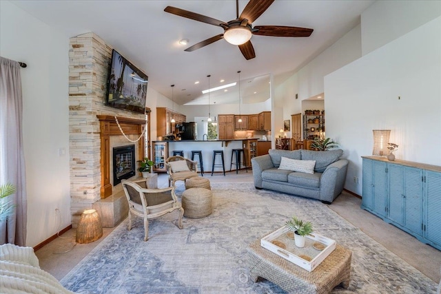 carpeted living room with high vaulted ceiling and ceiling fan