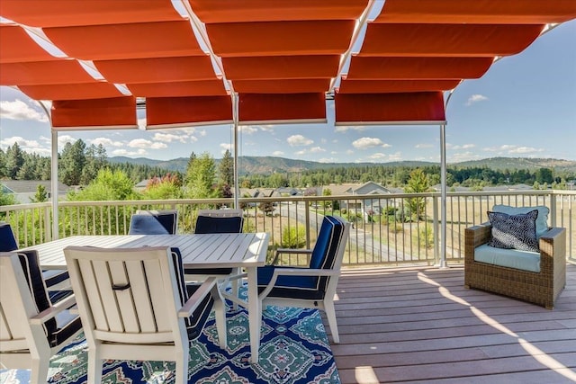 wooden deck featuring a mountain view