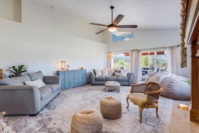 tiled living room featuring high vaulted ceiling and ceiling fan