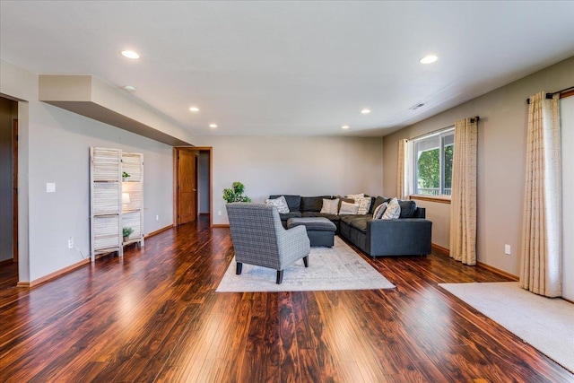 living room with dark hardwood / wood-style floors