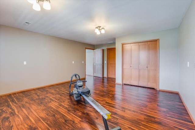 interior space featuring dark hardwood / wood-style flooring and a closet