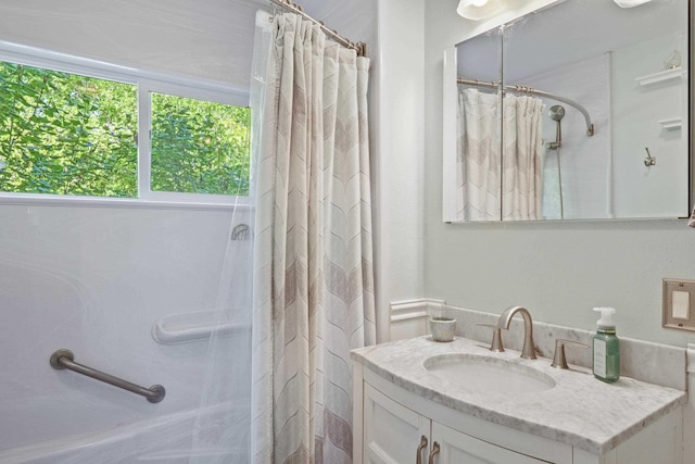 bathroom with vanity and a shower with curtain