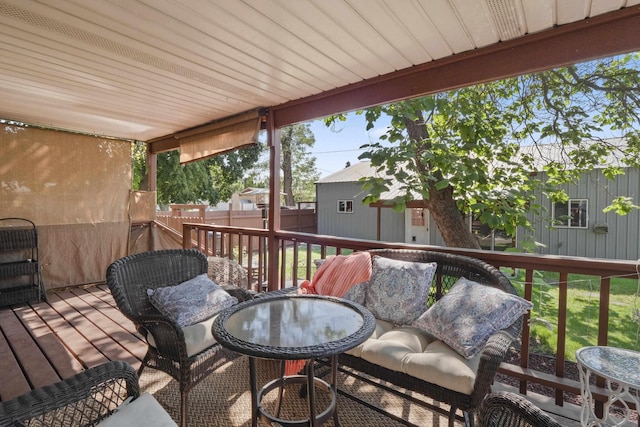 wooden deck featuring a storage shed