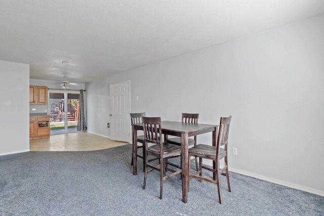 dining room with carpet floors and ceiling fan