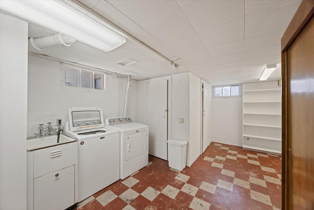 washroom featuring separate washer and dryer and sink