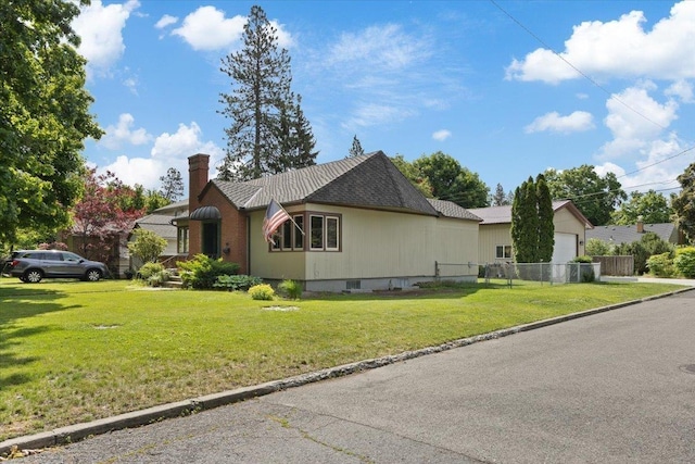 view of property exterior with a garage and a lawn