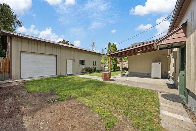 view of yard with an outbuilding and a garage