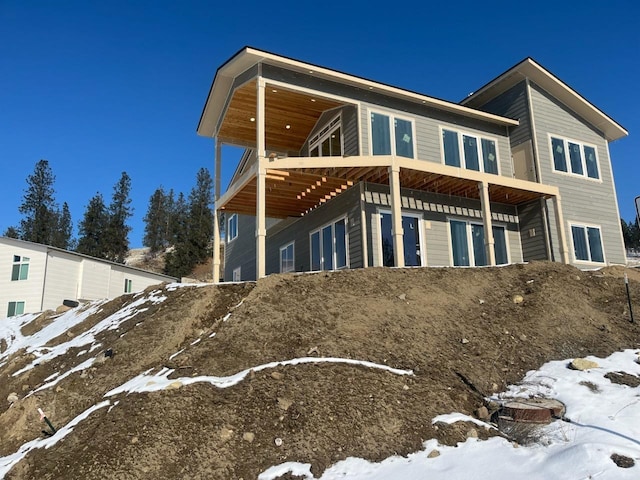 view of snow covered house