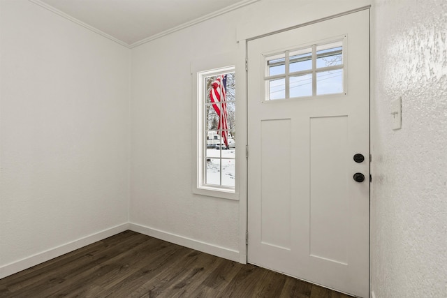 entryway with ornamental molding and dark hardwood / wood-style flooring