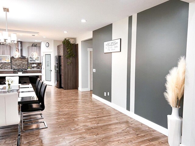 dining area with light wood-type flooring