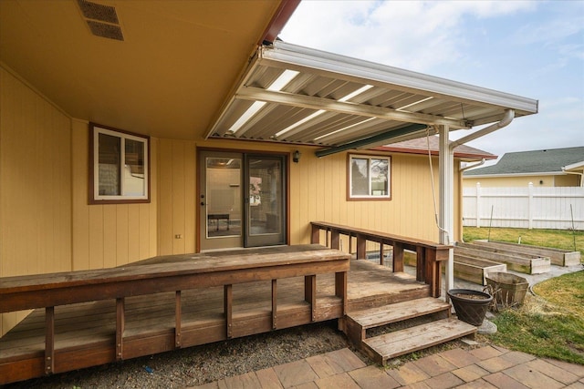 entrance to property featuring a deck