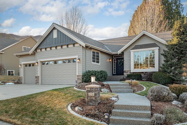 view of front of property with a garage and a front yard