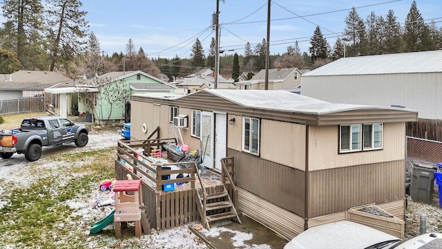 view of side of home featuring cooling unit