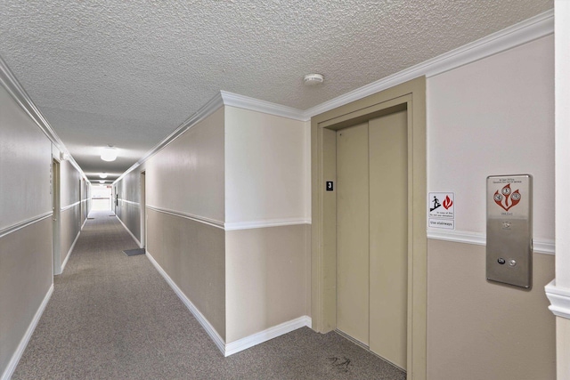 hall featuring elevator, ornamental molding, carpet flooring, and a textured ceiling