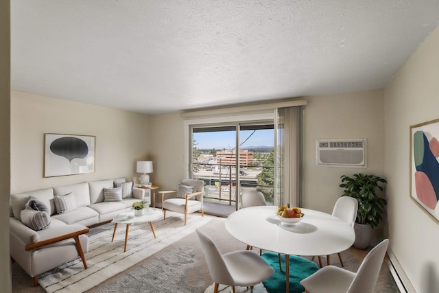 living room with a textured ceiling and a wall unit AC