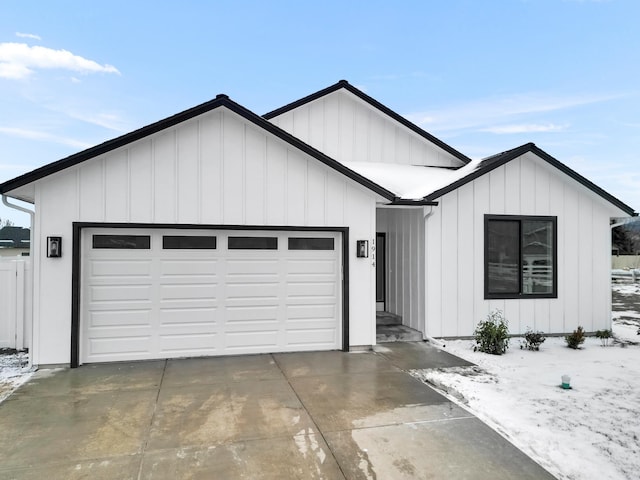 modern farmhouse style home featuring a garage