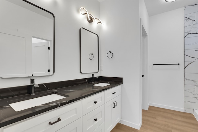 bathroom featuring vanity and hardwood / wood-style floors