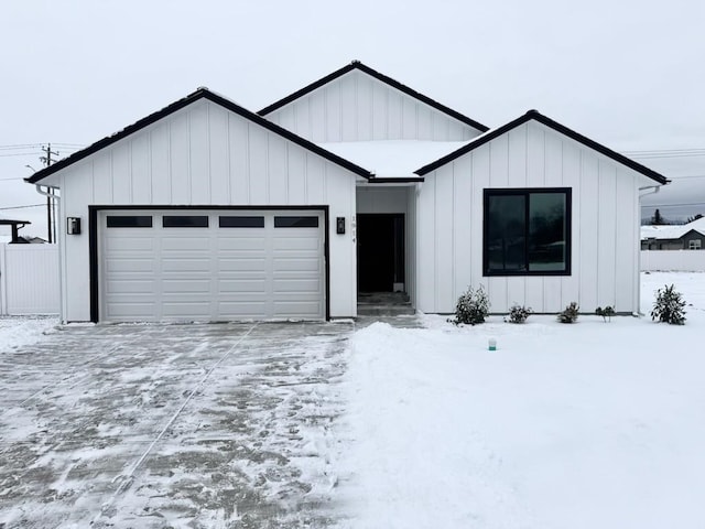 modern inspired farmhouse with a garage