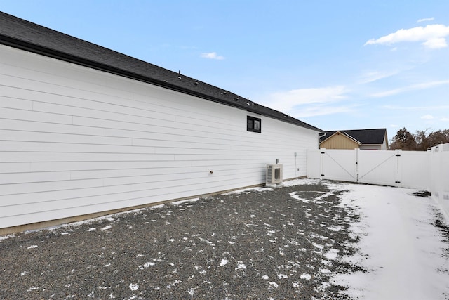 view of snowy exterior featuring ac unit