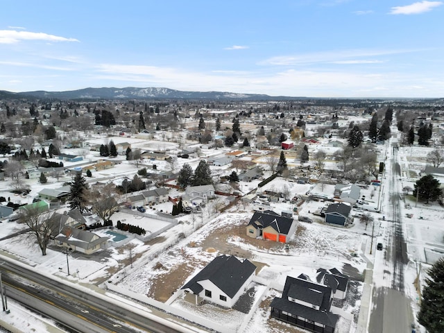 snowy aerial view featuring a mountain view