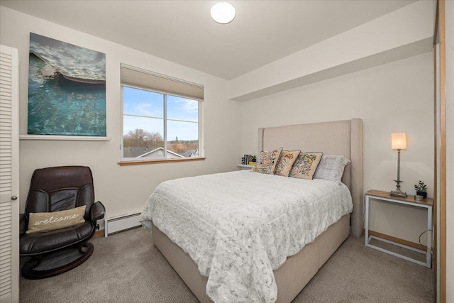 bedroom featuring baseboard heating and light carpet