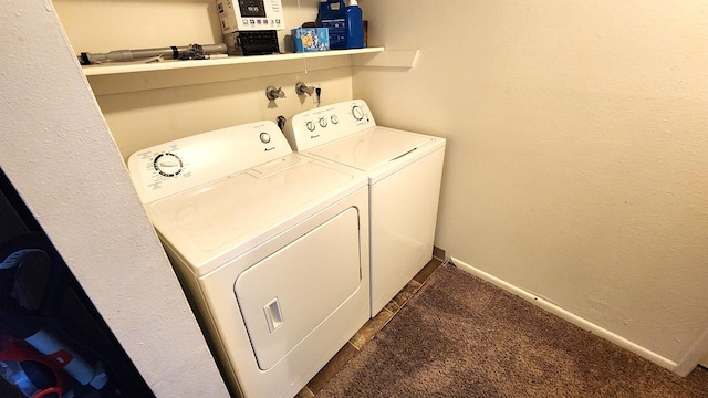 clothes washing area featuring washer and dryer and dark colored carpet