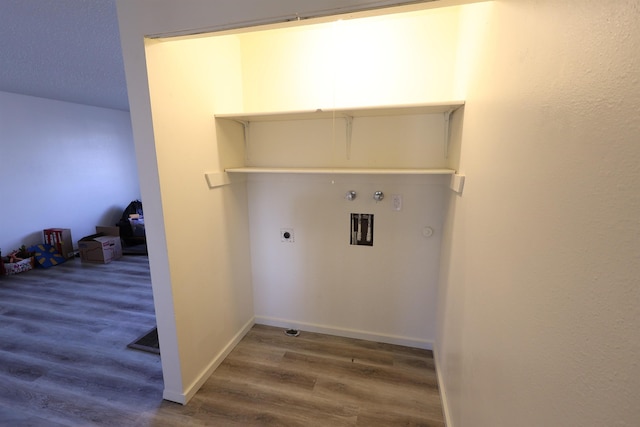 laundry room with electric dryer hookup, dark hardwood / wood-style floors, and washer hookup