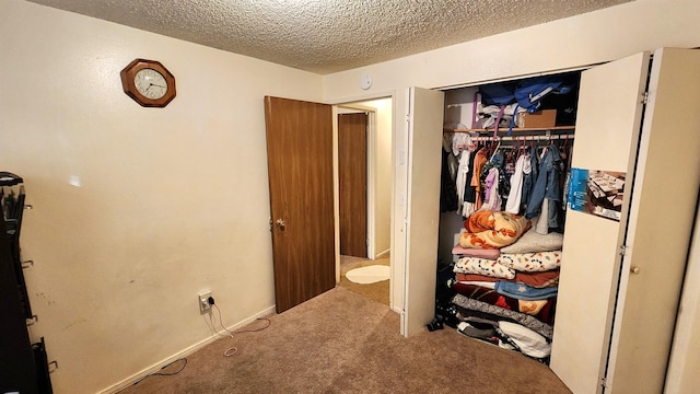 interior space with a closet and a textured ceiling