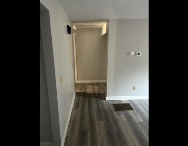 hall featuring dark wood-type flooring