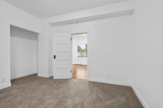 unfurnished bedroom with carpet floors