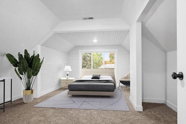 carpeted bedroom featuring lofted ceiling