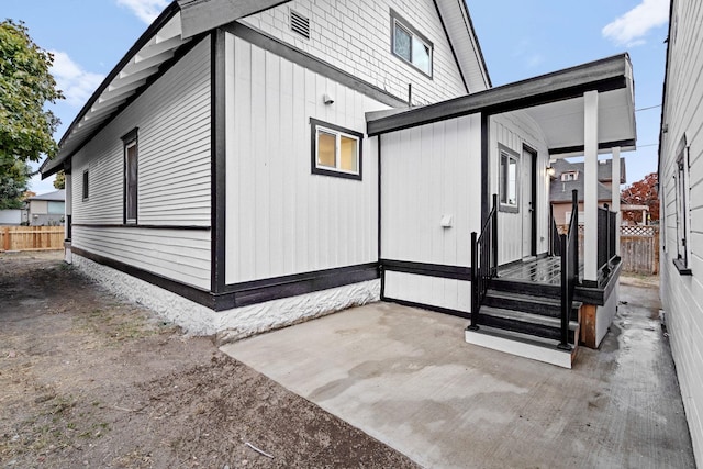 view of side of property featuring a patio