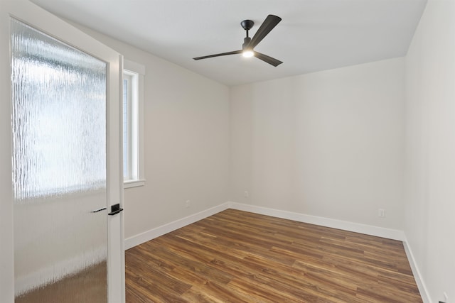 empty room featuring ceiling fan and wood-type flooring