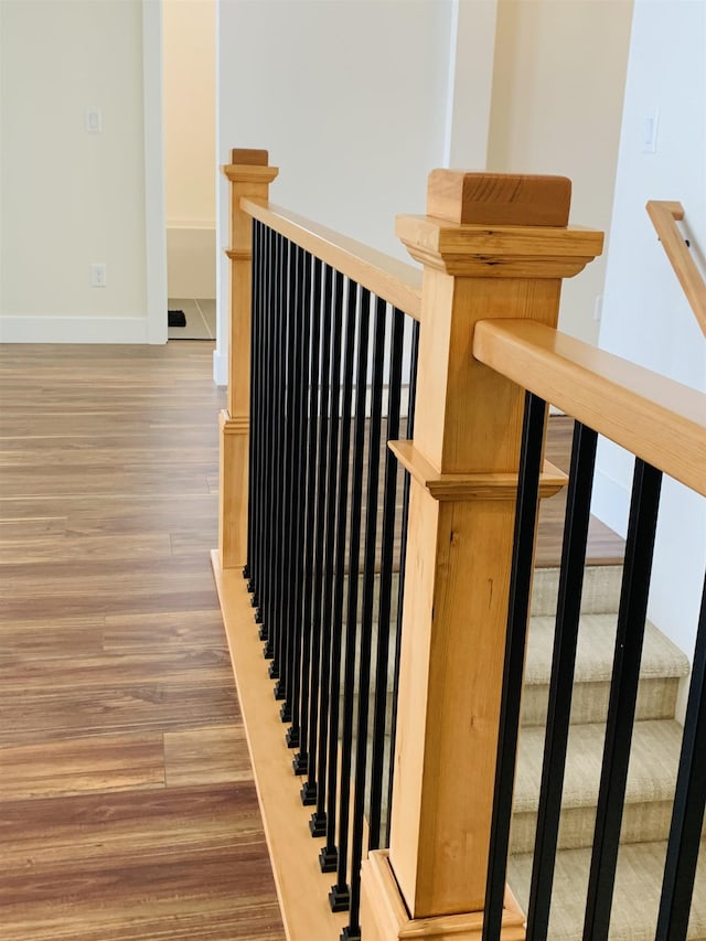 stairway with wood-type flooring