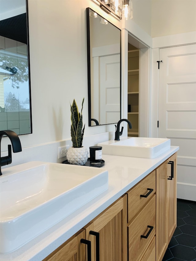 bathroom with vanity and tile patterned floors