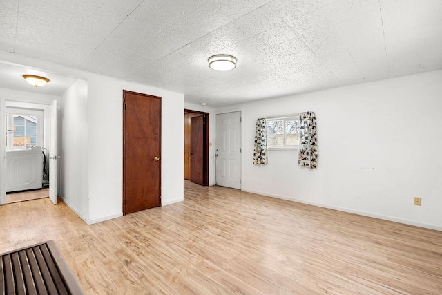 unfurnished room featuring light hardwood / wood-style floors