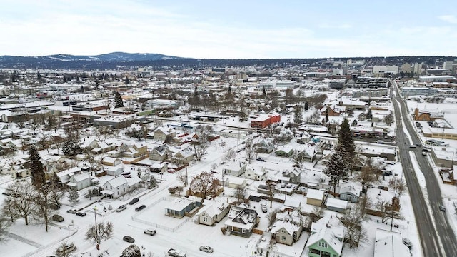 snowy aerial view with a mountain view