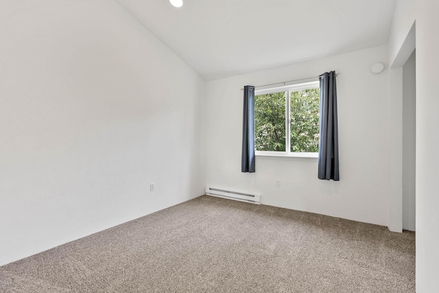 carpeted spare room featuring vaulted ceiling and baseboard heating