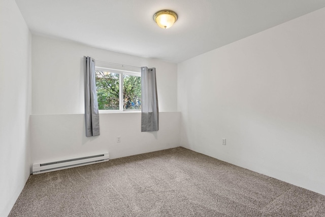 empty room with carpet flooring and baseboard heating