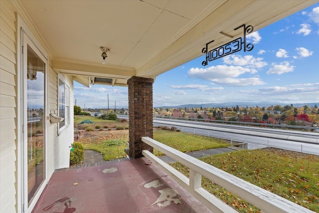 view of patio / terrace featuring a mountain view