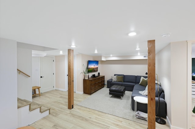 living area with stairway, wood finished floors, visible vents, baseboards, and recessed lighting