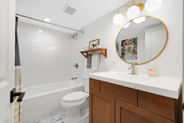 full bathroom with tiled shower / bath combo, vanity, and toilet