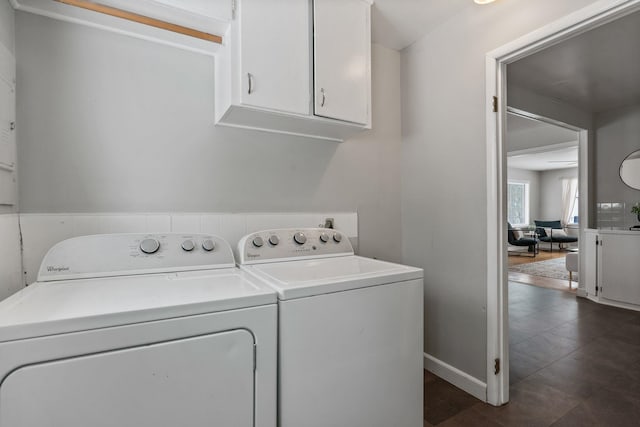 laundry area with cabinets and washing machine and dryer