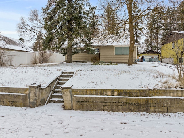 view of yard layered in snow