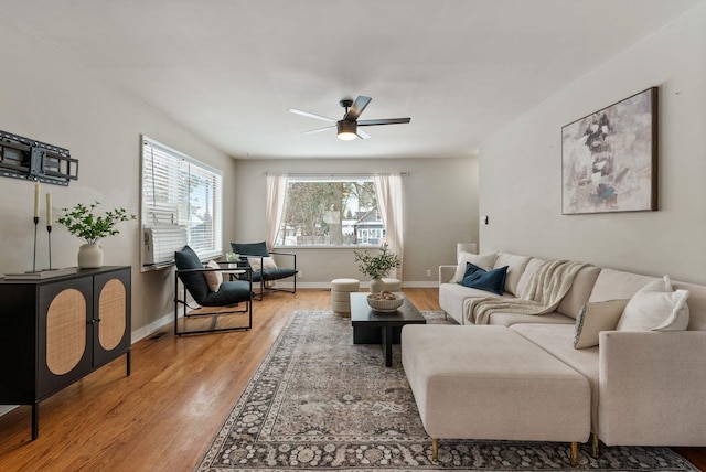 living room featuring hardwood / wood-style flooring and ceiling fan