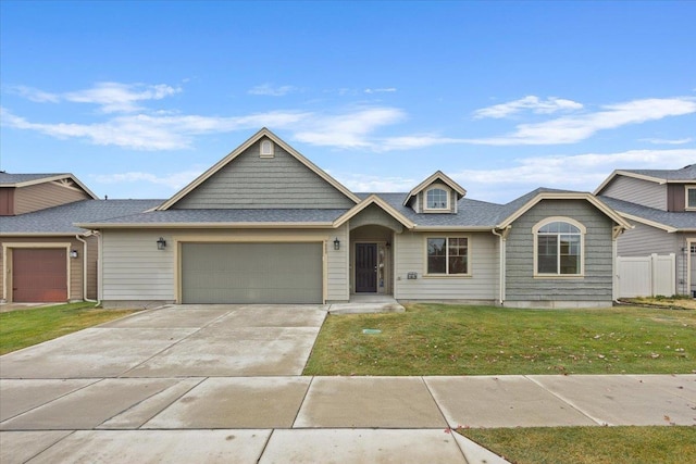 view of front facade featuring a garage and a front lawn