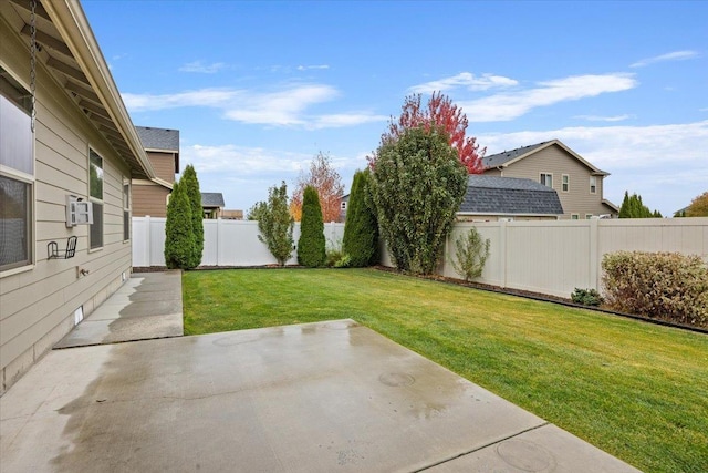 view of yard with cooling unit and a patio