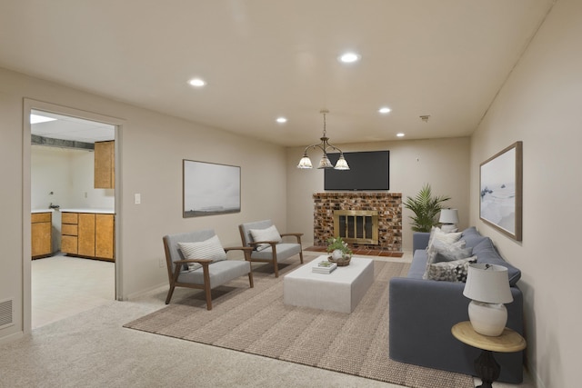 living room featuring a fireplace and light colored carpet