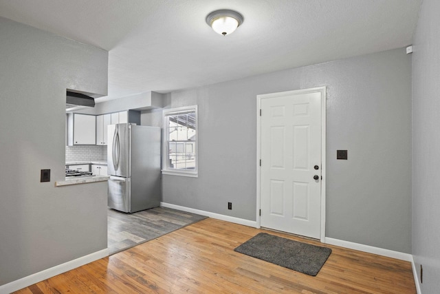 foyer with light hardwood / wood-style flooring