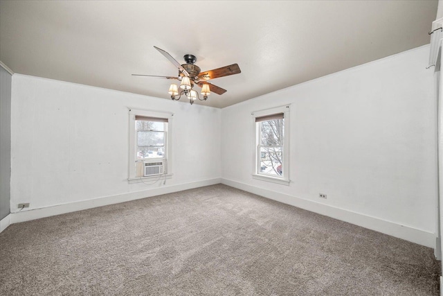 spare room with cooling unit, ceiling fan, plenty of natural light, and carpet floors